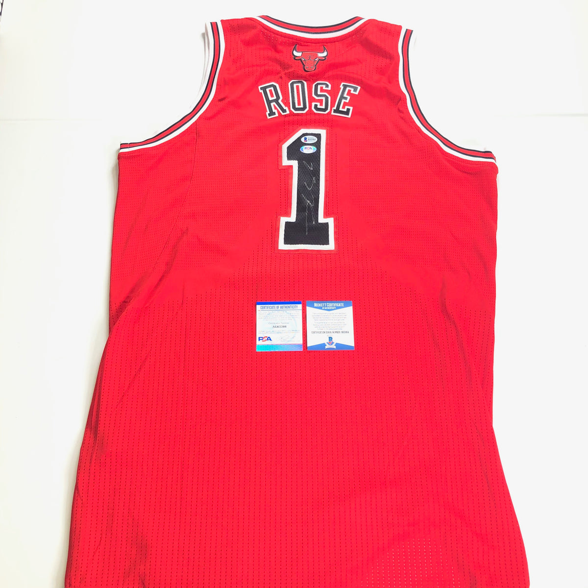 Sold at Auction: Derrick Rose #1 Autographed Jersey & Photograph